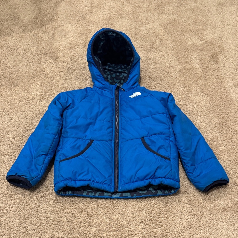 The North Face Blue Puffer Jacket! Reversible! Solid blue side shows some wear.